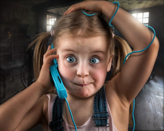 Little girl with a telephone