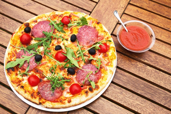 Pizza with Sausage, Tomatoes, and Arugula