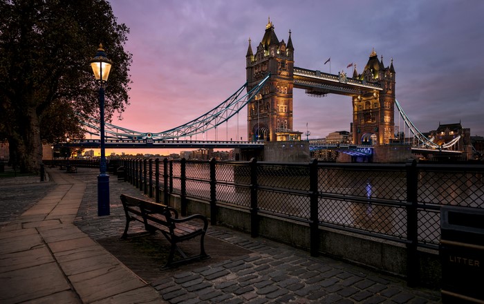 Tower Bridge at dusk with street lamp and bench