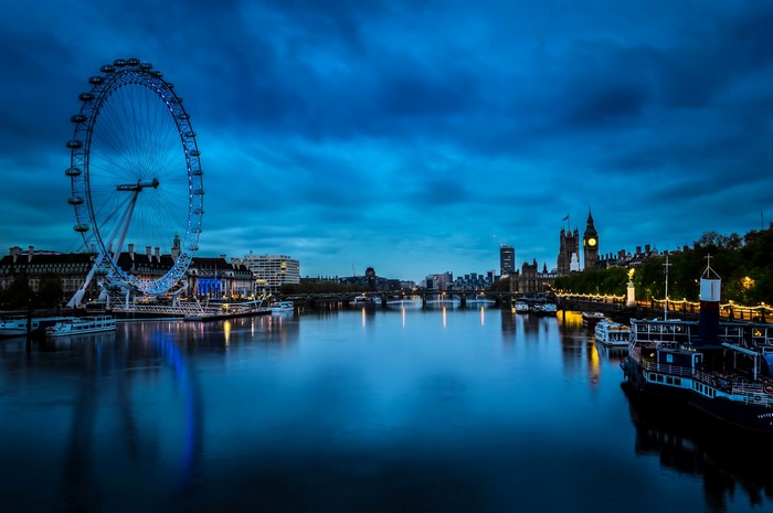 London Eye and Big Ben at night over the River Thames