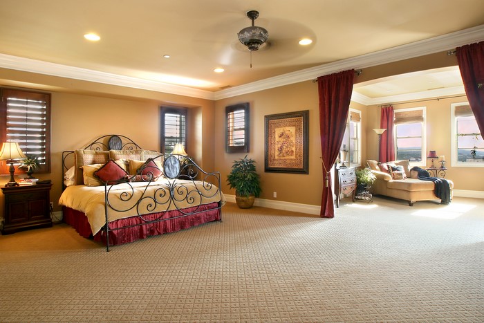 Luxurious bedroom with a large bed and sitting area