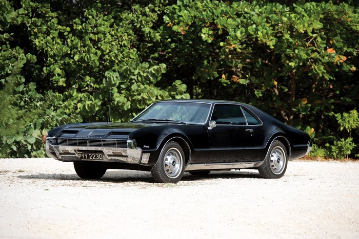 1966 Oldsmobile Toronado parked on gravel