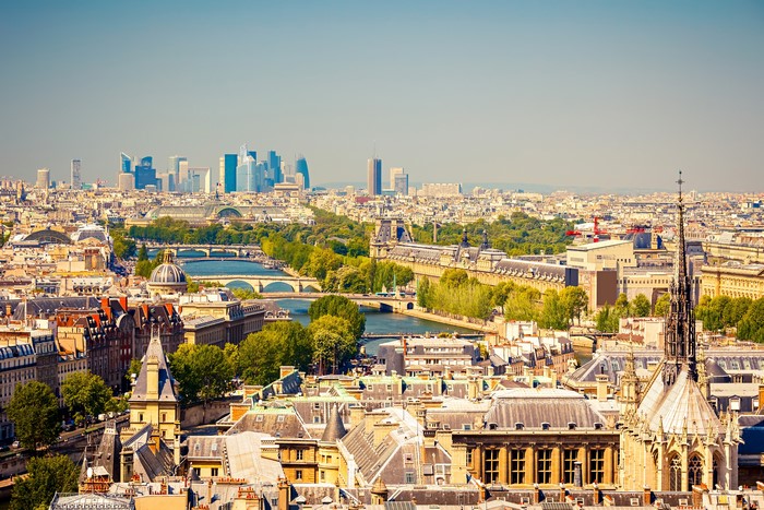 Paris cityscape with La Defense skyscrapers and Seine River