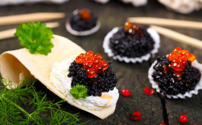 Caviar appetizers with salmon roe and dill