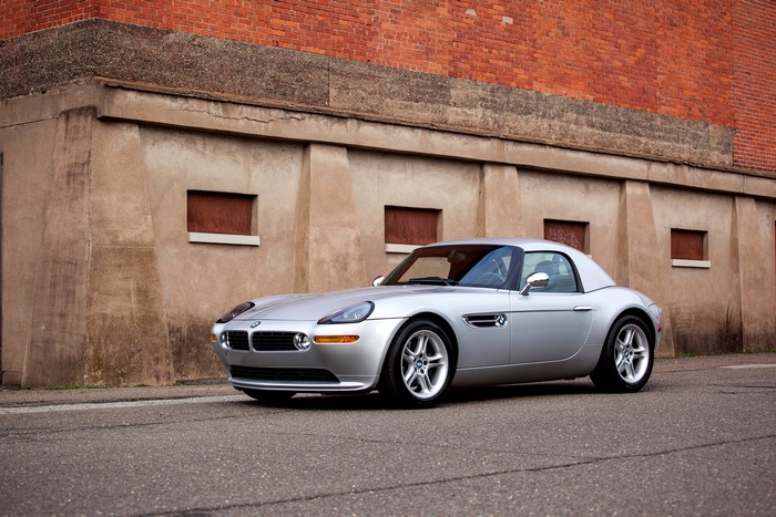 Silver BMW Z8 Roadster parked near a brick building