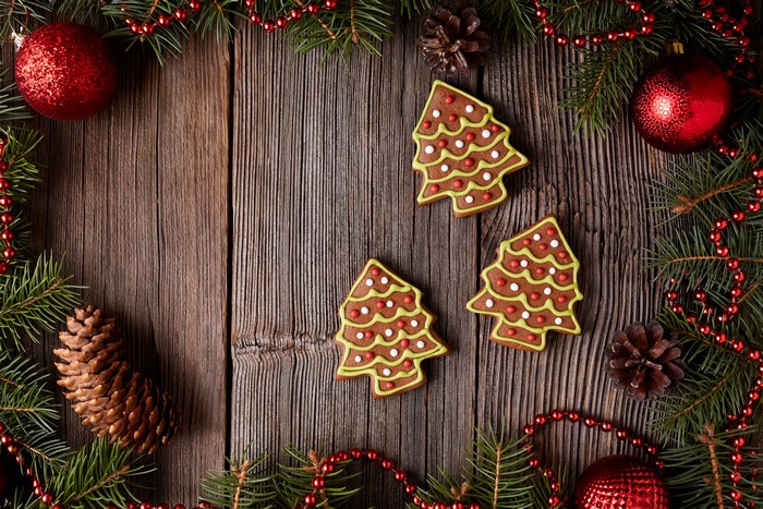 Christmas tree cookies with ornaments and pine cones