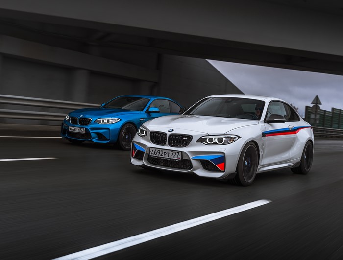 Two BMW M2 F87 Coupes on a Road