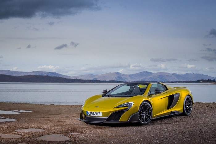 Yellow McLaren 675 LT Spider by a Lake