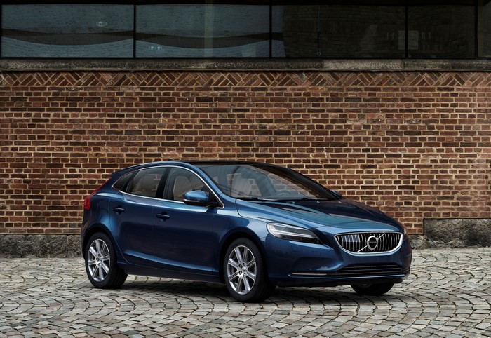 Blue 2016 Volvo V40 parked on cobblestone street