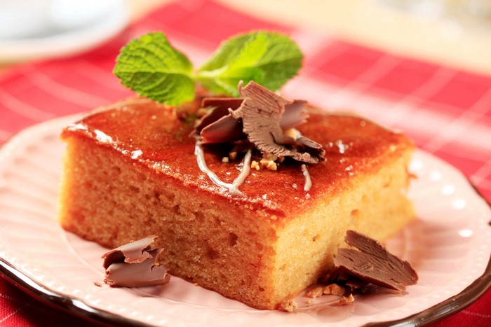 Slice of cake with chocolate shavings and mint