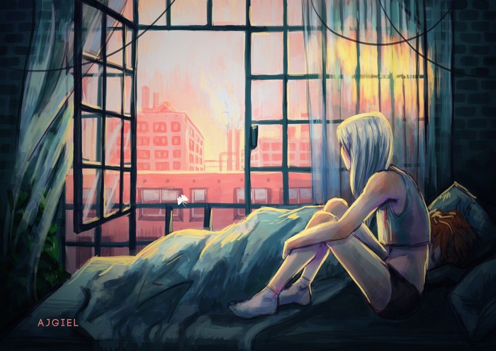 Girl sitting on a bed looking out a window at city