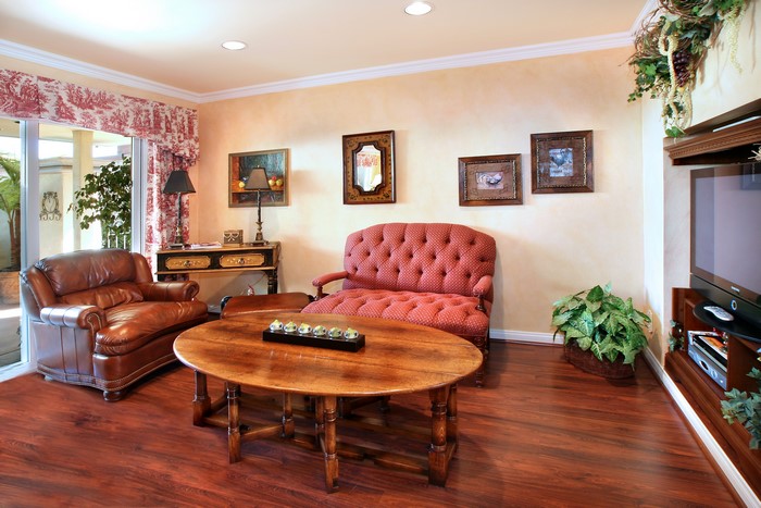 Living room with leather armchair, sofa, and coffee table