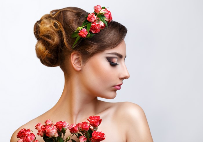 Woman with Roses in Hair and Bouquet