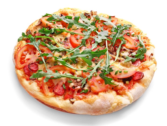 Pizza with tomatoes, arugula, and sausage