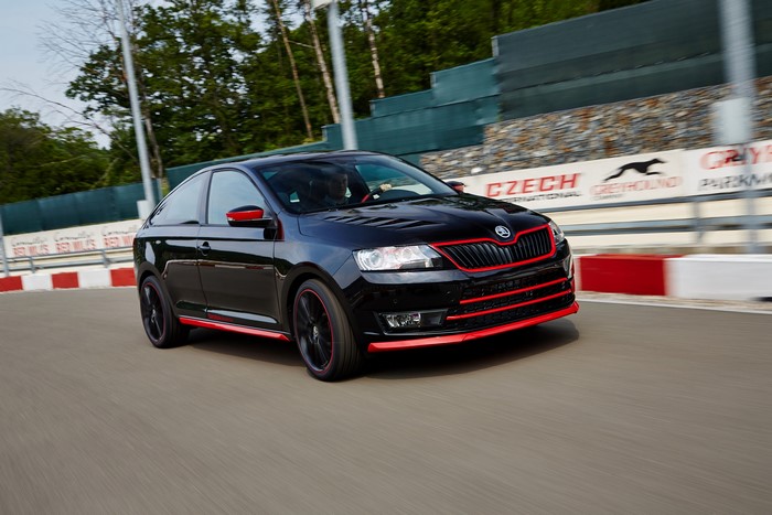 Black Skoda Rapid Sport with red accents on a race track