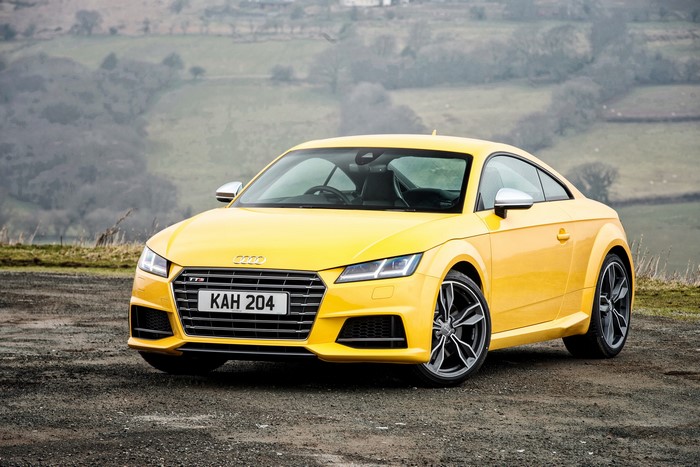 Yellow Audi TTS Coupe on a dirt road