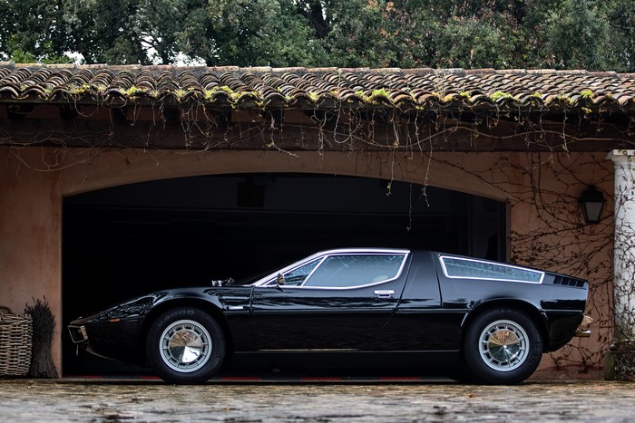 Black Maserati Bora parked in a garage