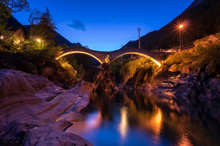 Stone bridge over a river at night in Lavertezzo, Switzerland
