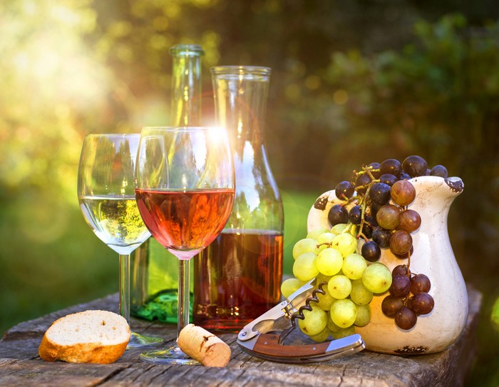 Wine, Grapes, and Bread on a Table