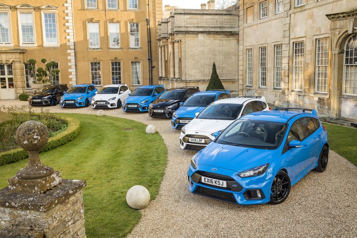 Many Ford Focus RS cars parked outside a building