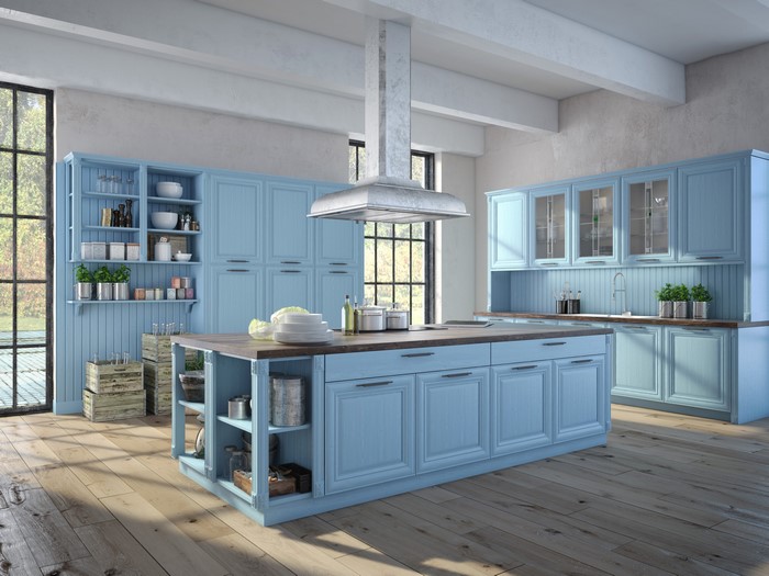 Blue kitchen with island and cabinets