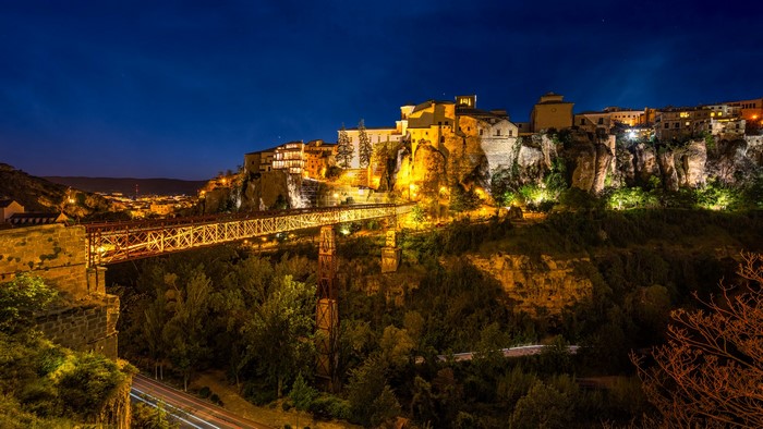 Cuenca, Spain at night with bridge and houses