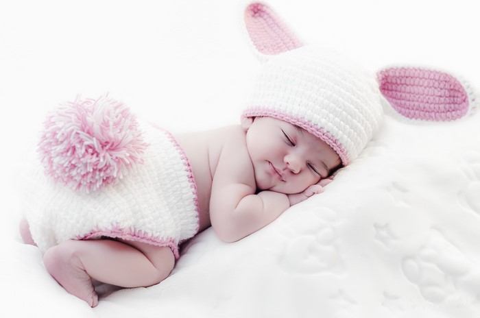 Baby in a bunny costume sleeping