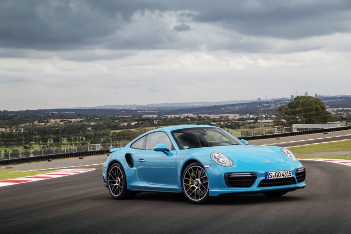 Light Blue Porsche 911 Turbo S Coupe on a Racetrack
