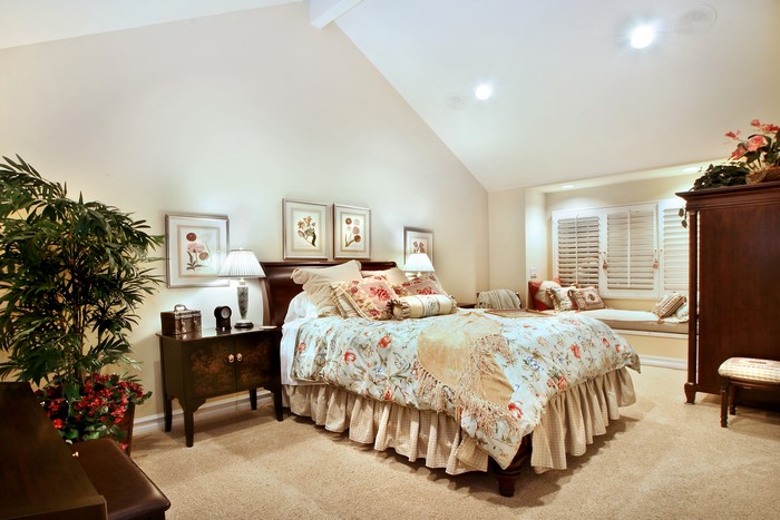 Bedroom with a bed, nightstand, and wardrobe