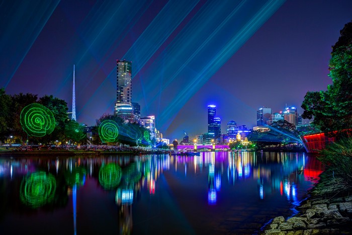 Melbourne skyline and Yarra River at night with light show