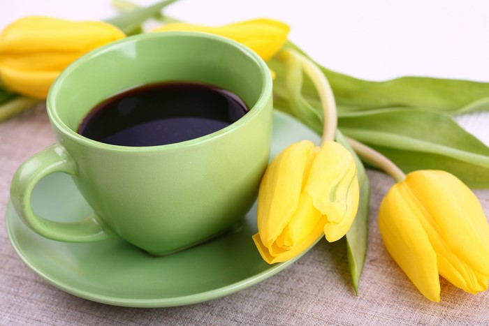 Coffee cup with yellow tulips