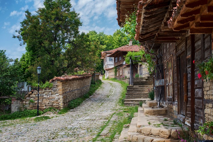 Cobblestone street in Zheravna, Bulgaria with old houses