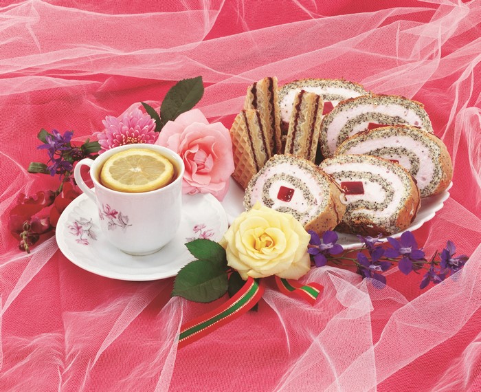 Still-life with tea, cakes, and roses