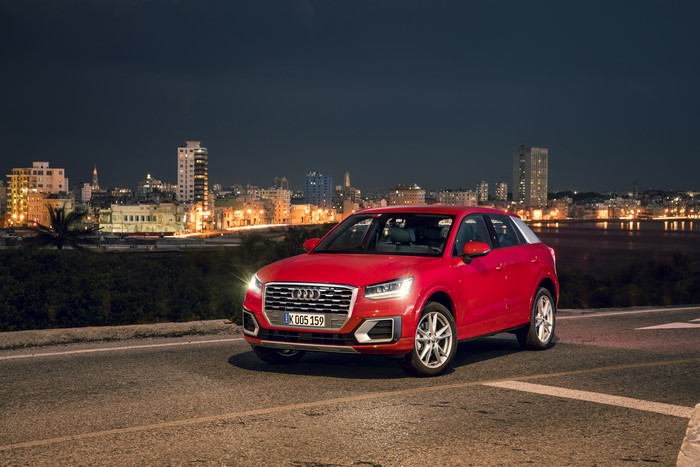 Red Audi Q2 TFSI quattro at night in city
