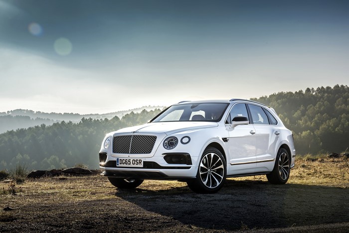 White Bentley Bentayga SUV on a hill
