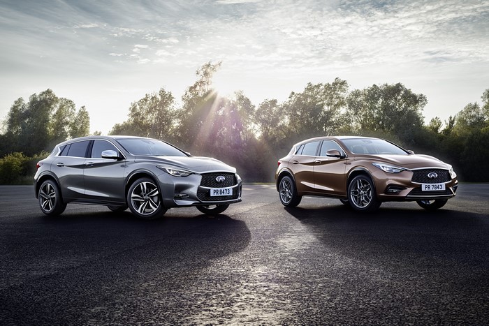 Two Infiniti Q30S cars on a road