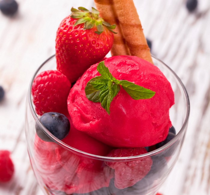 Raspberry and strawberry sorbet with berries and wafer