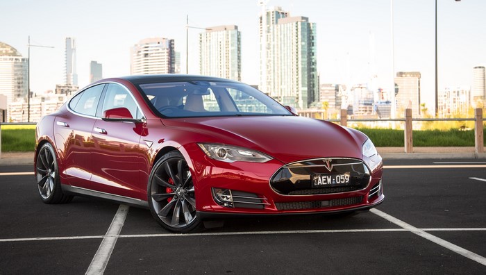 Red 2016 Tesla Model S P90D parked
