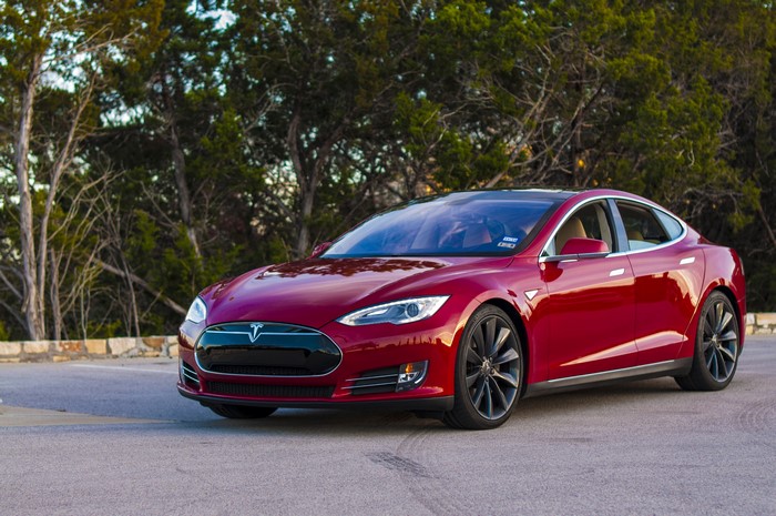 Red Tesla Model S P85 parked outdoors