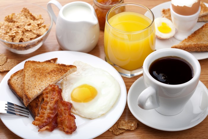 Breakfast with coffee, juice, and fried egg