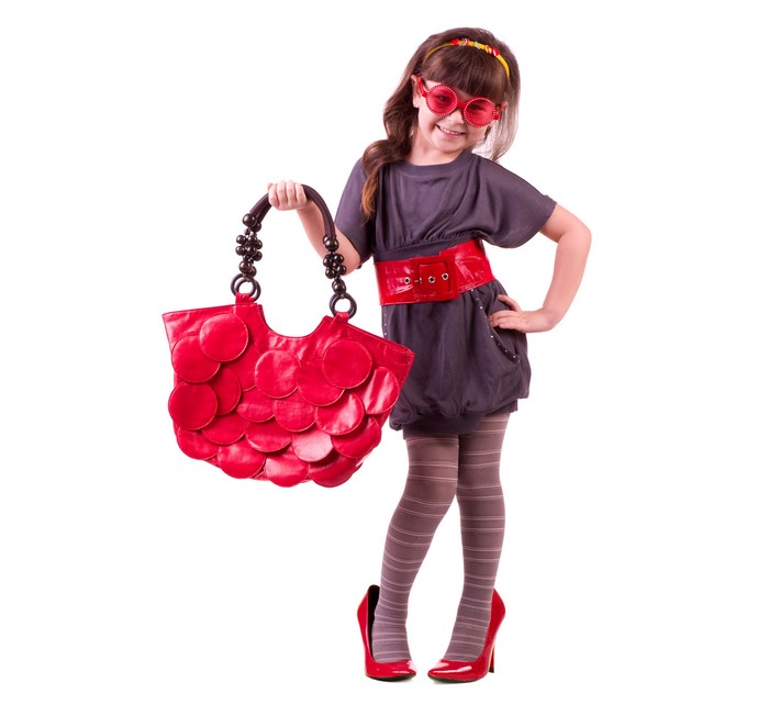 Stylish Little Girl in Dress and Red Accessories