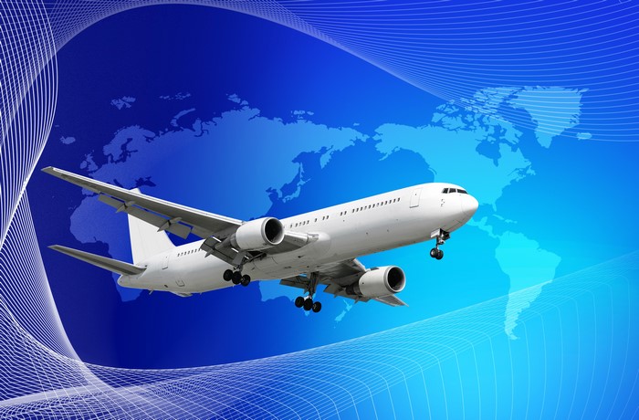 Airplane flying over world map with abstract lines
