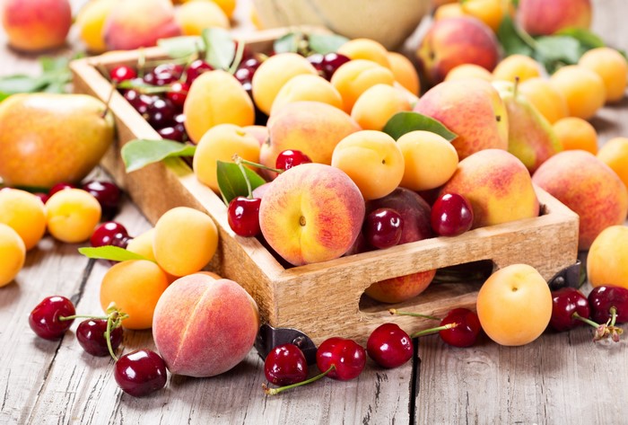 Peaches, Cherries, and Apricots in a Wooden Crate