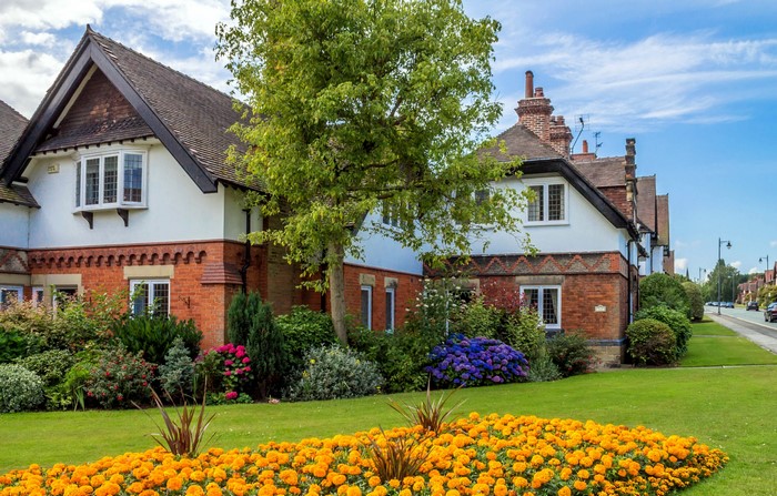 Houses on a street in the United Kingdom with gardens