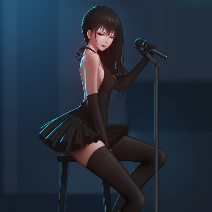 Brunette girl singing into a microphone