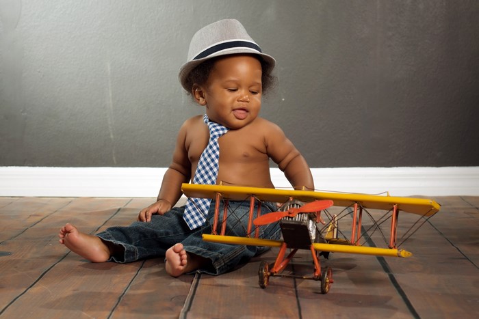 Baby Boy with Hat and Toy Airplane