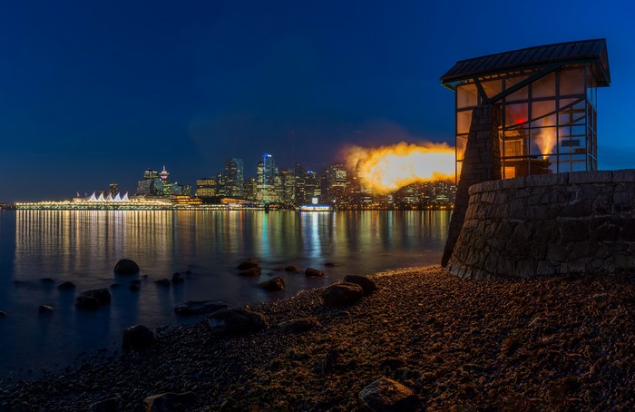 Vancouver waterfront at night with cannon firing