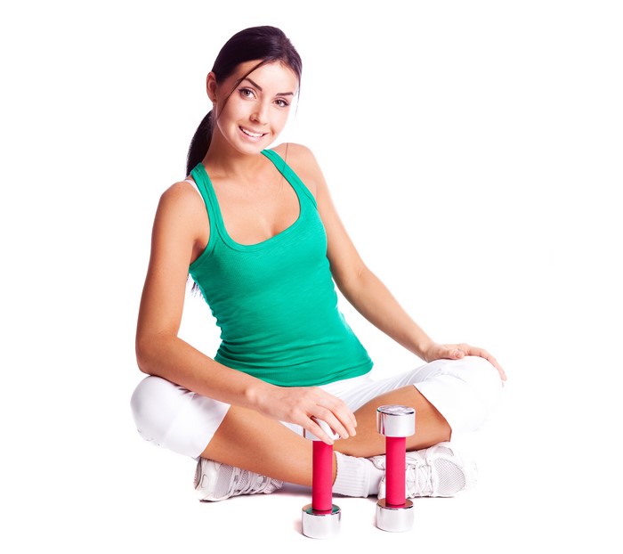 Woman with dumbbells on white background