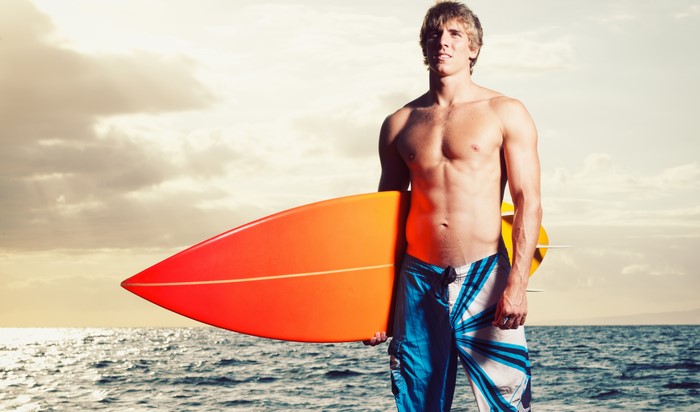 Man with surfboard on the sea