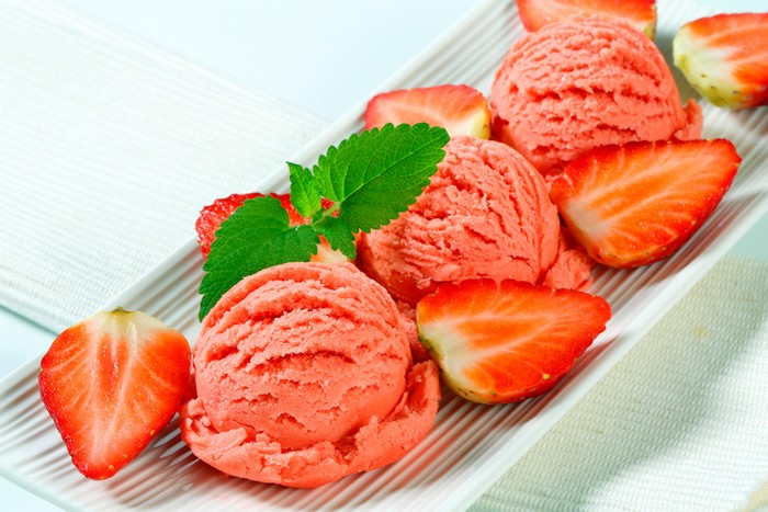 Strawberry ice cream with strawberries and mint